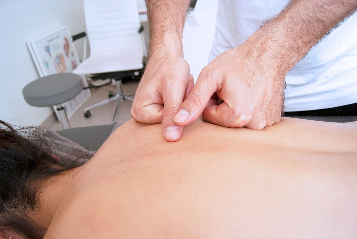Manual physiotherapy on a patient's back